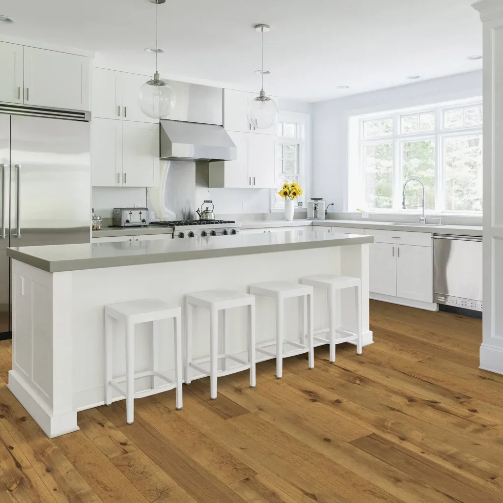 Hardwood floors in kitchen with white cabinets