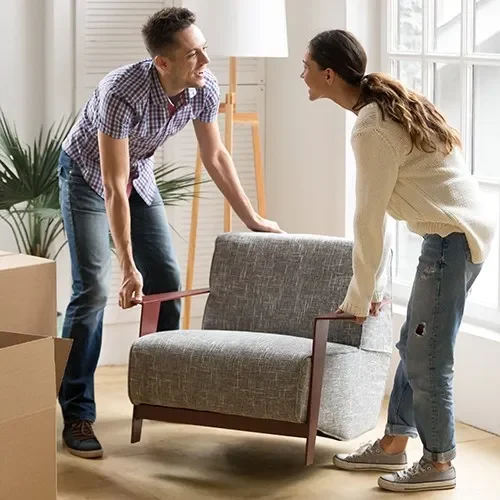 Couple moving furniture